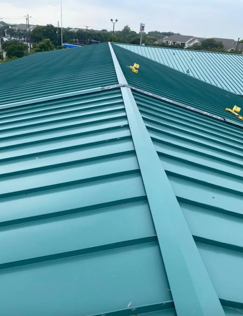 Green commercial metal roof ridge and valley for Metal Roof Repair in Sturgis