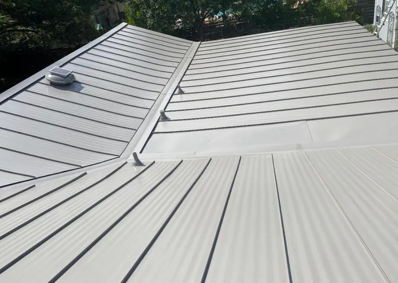 Solar attic fan installed on a metal roof for Roof Ventilation in Sturgis